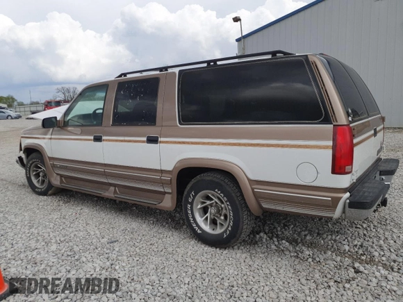 1999 Chevrolet Suburban with VIN 3GNEC16R9XG143471, listed as a Copart auction lot 53856565 with 208,621 mi miles and Salvage title. Bid and sale history available at DreamBid. Image 2.