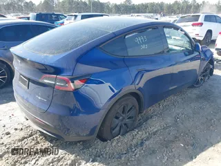 2025 Tesla Model Y Long Range with VIN 7SAYGDEEXSA346006, listed as a IAAI auction lot 41835610 with 1,896 mi miles and . Bid and sale history available at carsss.com. Image 4.