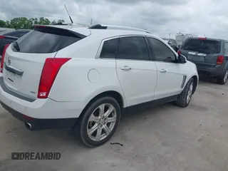 2014 Cadillac SRX Premium Collection with VIN 3GYFNDE31ES615995, listed as a IAAI auction lot 42148943 with 232,752 mi miles and . Bid and sale history available at DreamBid. Image 4.