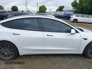 2023 Tesla Model 3 z VIN 5YJ3E1EA1PF545223, wystawiony jako IAAI lot #41591588 z przebiegiem 26 523 mil mil oraz . Historia ofert i sprzedaży dostępna na DreamBid. Obrazek 13.