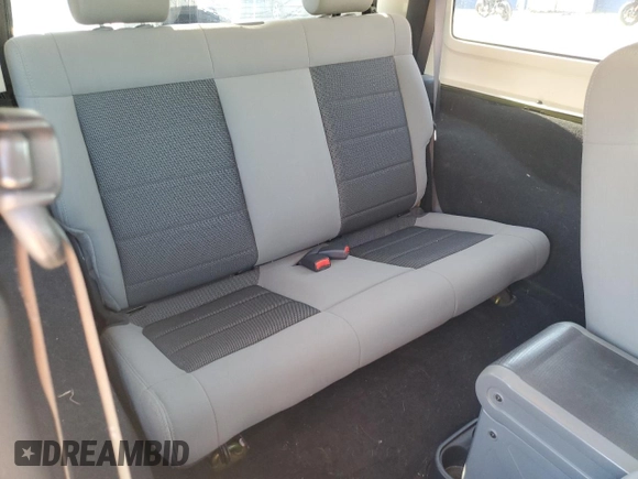 2010 Jeep Wrangler Sahara with VIN 1J4AA5D16AL203910, listed as a Copart auction lot 62891315 with 124,337 mi miles and Salvage title. Bid and sale history available at DreamBid. Image 11.