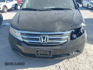 2012 Honda Odyssey EX-L with VIN 5FNRL5H6XCB016801, listed as a IAAI auction lot 42112141 with 164,671 mi miles and . Bid and sale history available at carsss.com. Image 6.