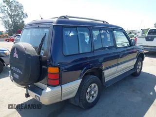 1995 Mitsubishi Montero z VIN JA4MR41H4SJ006684, wystawiony jako IAAI lot #42389482 z przebiegiem 399 099 mil mil oraz . Historia ofert i sprzedaży dostępna na DreamBid. Obrazek 4.