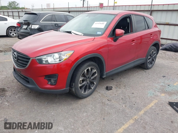 2016 Mazda CX-5 Grand Touring with VIN JM3KE2DY8G0871574, listed as a IAAI auction lot 41959686 with 95,416 mi miles and . Bid and sale history available at DreamBid. Image 17.