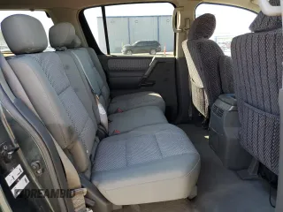 2005 Nissan Armada LE z VIN 5N1AA08A05N710696, wystawiony jako Copart lot #46854495 z przebiegiem 211 883 mil mil oraz Szkoda całkowita • Salvage title. Historia ofert i sprzedaży dostępna na DreamBid. Obrazek 11.