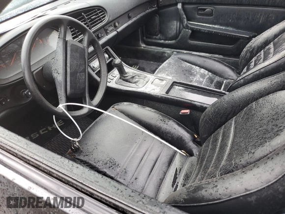 1987 Porsche 944 z VIN WP0AB0946HN474232, wystawiony jako Copart lot #64654684 z przebiegiem 87 126 mil mil oraz Szkoda całkowita • Salvage title. Historia ofert i sprzedaży dostępna na DreamBid. Obrazek 7.