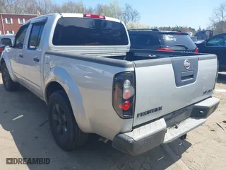 2011 Nissan Frontier PRO-4X with VIN 1N6AD0EVXBC407089, listed as a IAAI auction lot 42113537 with 124,853 mi miles. Bid and sale history available at carsss.com. Image 3.
