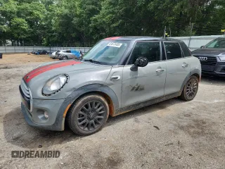 2015 MINI Hardtop 4 Door with VIN WMWXS5C5XFT831555, listed as a Copart auction lot 61673485 with 104,120 mi miles and Salvage title. Bid and sale history available at DreamBid. Image 1.