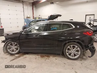 2020 BMW X2 xDrive28i z VIN WBXYJ1C00L5R79711, wystawiony jako IAAI lot #41051383 z przebiegiem Nie podano mil oraz . Historia ofert i sprzedaży dostępna na DreamBid. Obrazek 13.