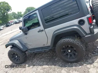 2016 Jeep Wrangler Black Bear with VIN 1C4AJWAG5GL258426, listed as a IAAI auction lot 42400914 with 128,606 mi miles and . Bid and sale history available at DreamBid. Image 14.
