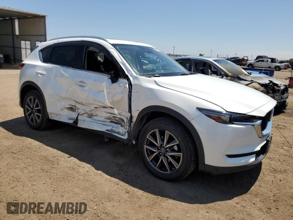 2018 Mazda CX-5 Grand Touring z VIN JM3KFBDM1J0473754, wystawiony jako Copart lot #60362245 z przebiegiem 72 792 mil mil oraz Szkoda całkowita • Salvage title. Historia ofert i sprzedaży dostępna na DreamBid. Obrazek 4.