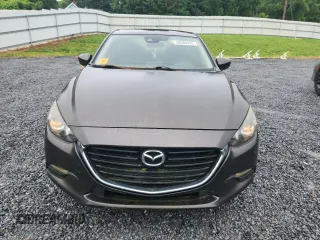 2017 Mazda 3 Touring z VIN 3MZBN1V70HM112387, wystawiony jako Copart lot #59580965 z przebiegiem 109 799 mil mil oraz Czysty tytuł • Clean title. Historia ofert i sprzedaży dostępna na DreamBid. Obrazek 5.