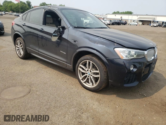 2015 BMW X4 xDrive35i with VIN 5UXXW5C59F0E87517, listed as a Copart auction lot 59604445 with 185,064 mi miles and Salvage title. Bid and sale history available at DreamBid. Image 4.