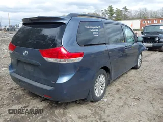 2014 Toyota Sienna XLE with VIN 5TDYK3DC9ES511035, listed as a IAAI auction lot 41884115 with 153,071 mi miles. Bid and sale history available at carsss.com. Image 4.