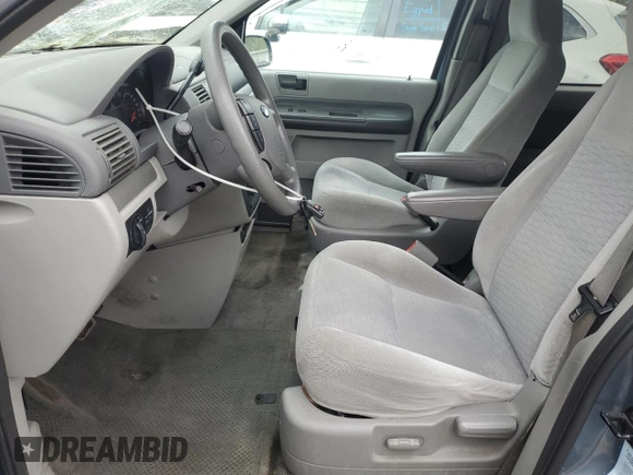 2005 Ford Freestar SE z VIN 2FMDA51605BA50204, wystawiony jako Copart lot #56002955 z przebiegiem 212 942 mil mil oraz Szkody całkowita. Historia ofert i sprzedaży dostępna na DreamBid. Obrazek 7.