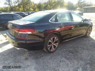 2021 Volkswagen Passat 2.0T SE with VIN 1VWSA7A34MC014993, listed as a IAAI auction lot 40556424 with 64,508 mi miles. Bid and sale history available at carsss.com. Image 4.