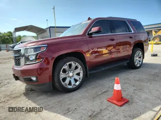 2019 Chevrolet Tahoe LT with VIN 1GNSKBKCXKR258408, listed as a Copart auction lot 64779645 with 118,894 mi miles and Salvage title. Bid and sale history available at DreamBid. Image 1.