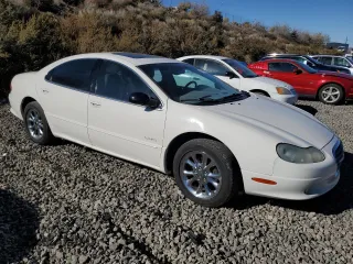2001 Chrysler LHS z VIN 2C3AC56GX1H547856, wystawiony jako Copart lot #77842124 z przebiegiem 97 378 mil mil oraz Tytuł czysty. Historia ofert i sprzedaży dostępna na DreamBid. Obrazek 4.