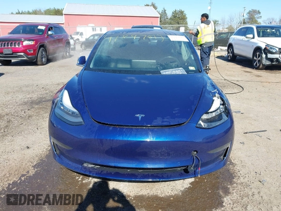 2018 Tesla Model 3 Long Range Battery z VIN 5YJ3E1EB5JF180030, wystawiony jako IAAI lot #41897617 z przebiegiem 89 557 mil mil oraz . Historia ofert i sprzedaży dostępna na DreamBid. Obrazek 12.