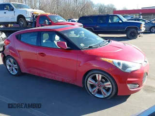 2013 Hyundai Veloster w/Black Int with VIN KMHTC6AD3DU146038, listed as a IAAI auction lot 41433673 with 173,283 mi miles and . Bid and sale history available at DreamBid. Image 1.