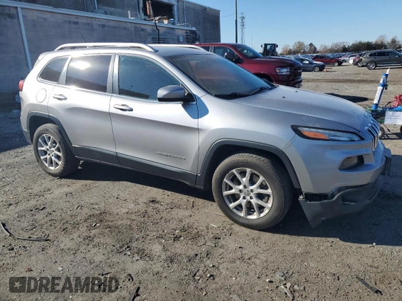2014 Jeep Cherokee Altitude with VIN 1C4PJMCS9EW232388, listed as a Copart auction lot 82842674 with 169,458 mi miles and Salvage Title. Bid and sale history available at carsss.com. Image 4.