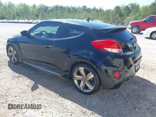 2013 Hyundai Veloster Turbo w/Black Int with VIN KMHTC6AE8DU175611, listed as a IAAI auction lot 42057549 with 137,929 mi miles. Bid and sale history available at carsss.com. Image 3.