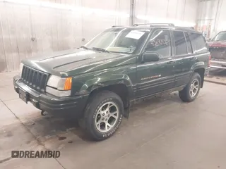 1997 Jeep Grand Cherokee Limited with VIN 1J4GZ78Y0VC684023, listed as a IAAI auction lot 42090436 with 310,831 mi miles. Bid and sale history available at carsss.com. Image 2.