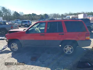 1996 Jeep Grand Cherokee Laredo with VIN 1J4EX58S8TC122302, listed as a IAAI auction lot 41218573 with 195,392 mi miles. Bid and sale history available at carsss.com. Image 14.
