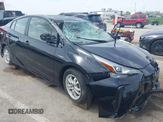2020 Toyota Prius L Eco z VIN JTDKARFU6L3119565, wystawiony jako IAAI lot #41990990 z przebiegiem Nie podano mil oraz . Historia ofert i sprzedaży dostępna na DreamBid. Obrazek 1.