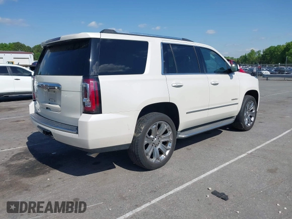 2015 GMC Yukon Denali with VIN 1GKS1CKJ3FR230797, listed as a IAAI auction lot 41977294 with 174,633 mi miles. Bid and sale history available at carsss.com. Image 4.