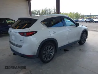 2020 Mazda CX-5 Grand Touring with VIN JM3KFBDM2L0863944, listed as a IAAI auction lot 42150805 with 63,932 mi miles and . Bid and sale history available at DreamBid. Image 4.