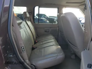 2000 Ford Explorer Eddie Bauer z VIN 1FMZU74E6YUB37521, wystawiony jako Copart lot #85994294 z przebiegiem 126 348 mil mil oraz Szkoda całkowita • Salvage title. Historia ofert i sprzedaży dostępna na DreamBid. Obrazek 11.
