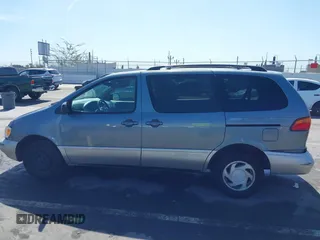 1999 Toyota Sienna LE with VIN 4T3ZF13C5XU099020, listed as a IAAI auction lot 41709287 with 206,884 mi miles. Bid and sale history available at carsss.com. Image 14.
