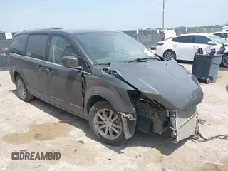 2018 Dodge Grand Caravan SXT z VIN 2C4RDGCG0JR218203, wystawiony jako IAAI lot #42043990 z przebiegiem 100 599 mil mil oraz . Historia ofert i sprzedaży dostępna na DreamBid. Obrazek 1.