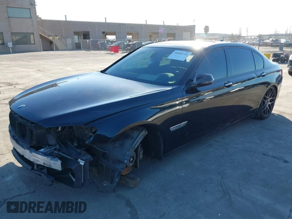 2014 BMW 7 Series 740Li with VIN WBAYE4C56ED137847, listed as a IAAI auction lot 39452255 with 184,471 mi miles. Bid and sale history available at carsss.com. Image 2.