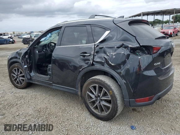 2018 Mazda CX-5 Grand Touring with VIN JM3KFADM3J1370114, listed as a Copart auction lot 54579585 with 65,513 mi miles and Salvage Title. Bid and sale history available at DreamBid. Image 2.