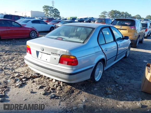 2000 BMW 5 Series 528iA with VIN WBADM6340YGU19599, listed as a IAAI auction lot 41139764 with 233,657 mi miles. Bid and sale history available at carsss.com. Image 4.