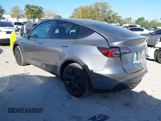 2025 Tesla Model Y Long Range with VIN 7SAYGDED7SA376233, listed as a IAAI auction lot 41777876 with 70 mi miles and . Bid and sale history available at DreamBid. Image 3.