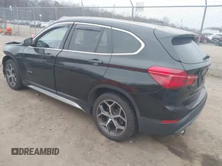 2017 BMW X1 xDrive28i with VIN WBXHT3C31H5F72958, listed as a IAAI auction lot 41782257 with 134,829 mi miles. Bid and sale history available at carsss.com. Image 3.