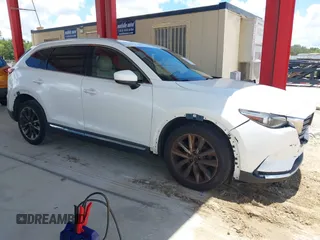 2016 Mazda CX-9 Grand Touring with VIN JM3TCADYXG0113563, listed as a IAAI auction lot 42593120 with 237,696 mi miles and . Bid and sale history available at DreamBid. Image 13.