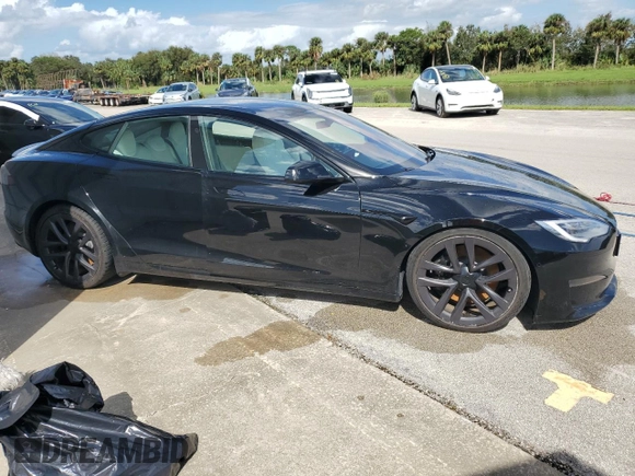 2022 Tesla Model S Plaid z VIN 5YJSA1E64NF461218, wystawiony jako Copart lot #74178794 z przebiegiem Nie podano mil oraz Szkoda całkowita • Salvage title. Historia ofert i sprzedaży dostępna na DreamBid. Obrazek 4.