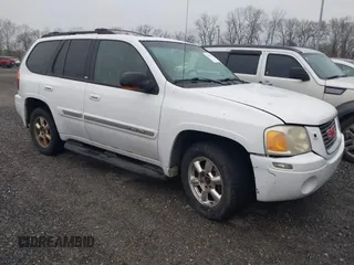 2003 GMC Envoy SLE with VIN 1GKDT13S732332171, listed as a IAAI auction lot 41520620 with 222,373 mi miles. Bid and sale history available at carsss.com. Image 1.