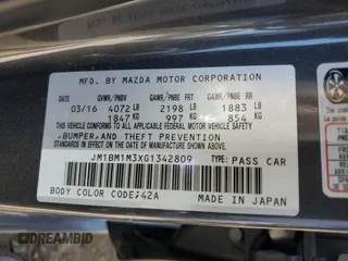 2016 Mazda 3 S Touring with VIN JM1BM1M3XG1342809, listed as a Copart auction lot 61915845 with 141,227 mi miles and Salvage title. Bid and sale history available at DreamBid. Image 12.