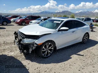 2021 Honda Civic Touring z VIN 19XFC1F92ME002035, wystawiony jako Copart lot #54873585 z przebiegiem 64 028 mil mil oraz Szkoda całkowita • Salvage title. Historia ofert i sprzedaży dostępna na DreamBid. Obrazek 1.