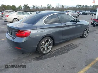 2015 BMW 2 Series 228i with VIN WBA1F5C59FV257447, listed as a IAAI auction lot 41706206 with 119,086 mi miles. Bid and sale history available at carsss.com. Image 4.