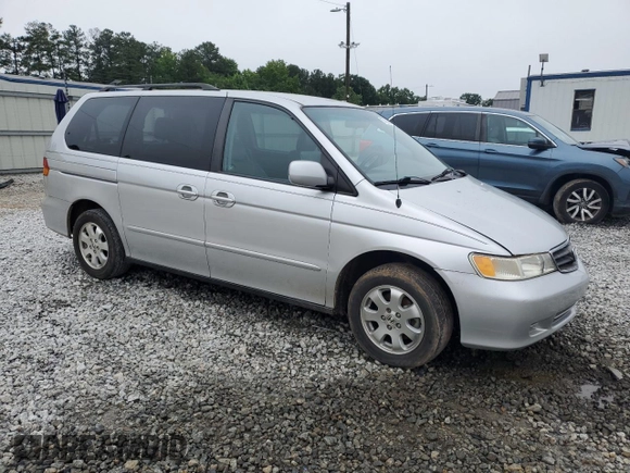 2004 Honda Odyssey EX-L with VIN 5FNRL18044B069774, listed as a Copart auction lot 57096535 with 165,307 mi miles and Salvage title. Bid and sale history available at DreamBid. Image 4.