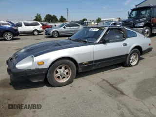 1982 Datsun 280ZX z VIN JN1HZ04SXCX448748, wystawiony jako Copart lot #87670125 z przebiegiem 136 264 mil mil oraz Szkody całkowita. Historia ofert i sprzedaży dostępna na DreamBid. Obrazek 1.