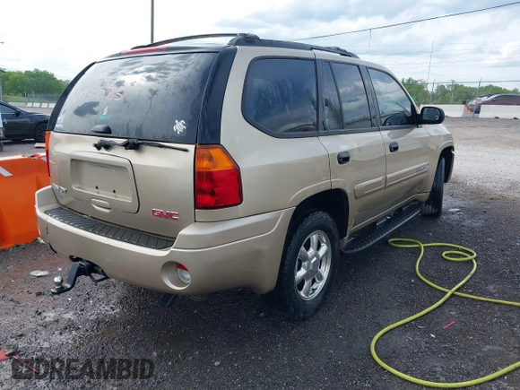 2005 GMC Envoy SLT with VIN 1GKDS13S452141376, listed as a IAAI auction lot 42095025 with 198,911 mi miles and . Bid and sale history available at DreamBid. Image 4.