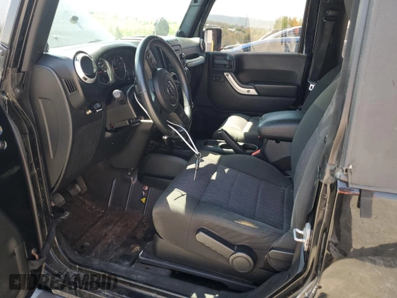 2011 Jeep Wrangler Sahara with VIN 1J4AA5D14BL542912, listed as a Copart auction lot 65158784 with 122,795 mi miles and Salvage Title. Bid and sale history available at DreamBid. Image 7.
