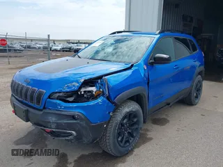 2022 Jeep Cherokee Trailhawk z VIN 1C4PJMBX4ND513488, wystawiony jako IAAI lot #42137114 z przebiegiem 12 306 mil mil oraz . Historia ofert i sprzedaży dostępna na DreamBid. Obrazek 21.